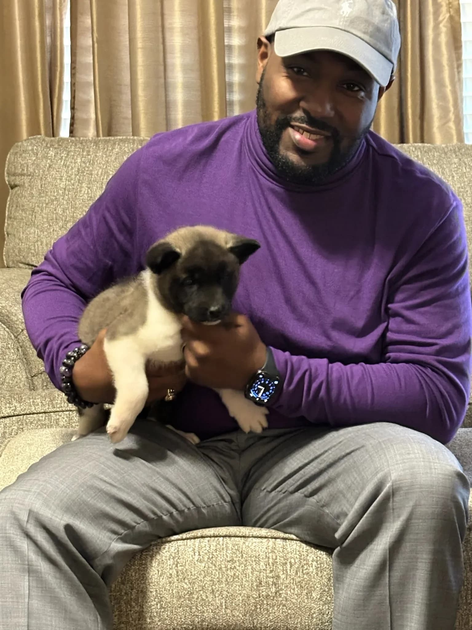 The Briwder family with an Akita puppy